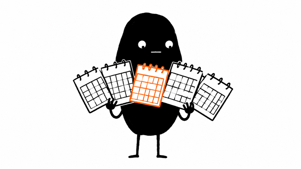 Lev holds five small calendars fanned like playing cards, one of them orange.