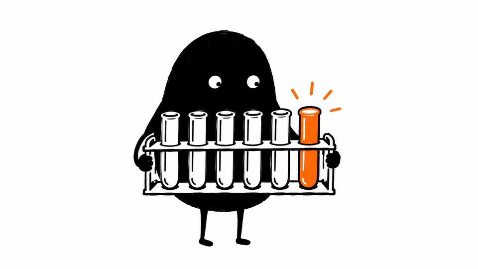 Lev holds a rack of six test tubes in which only one, in orange, glows.