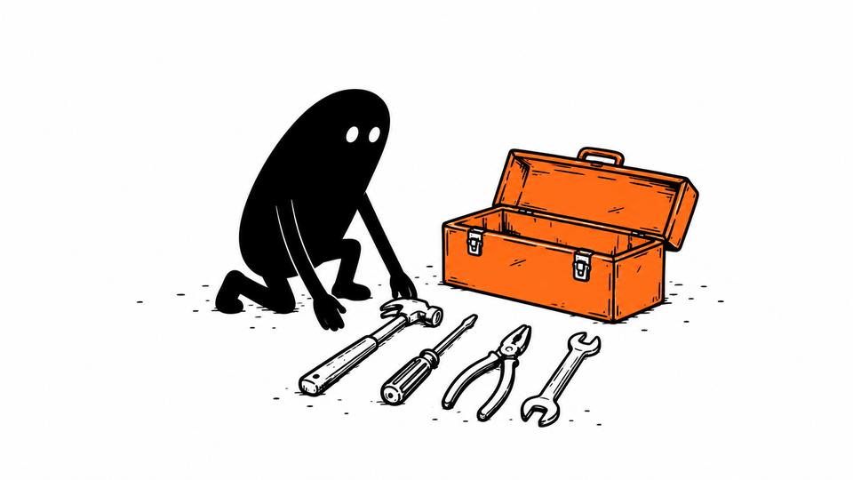 Lev lays the tools from an orange toolbox out in a neat row.