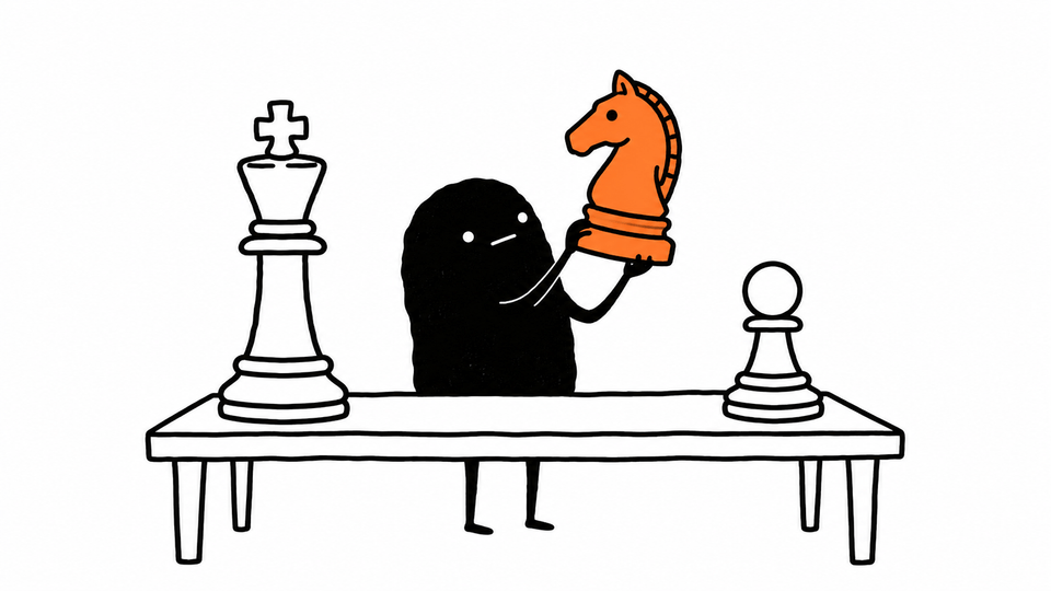 Lev lifts an orange knight from a table holding three very different chess pieces.
