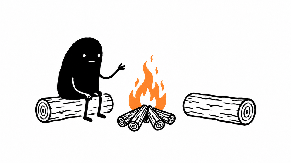 Lev tells a story beside a small orange campfire, facing an empty log.