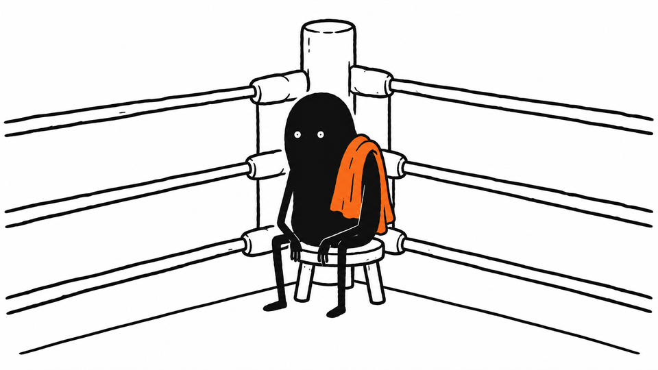 Lev sits on a stool in the corner of a boxing ring between rounds, an orange towel over his shoulder.