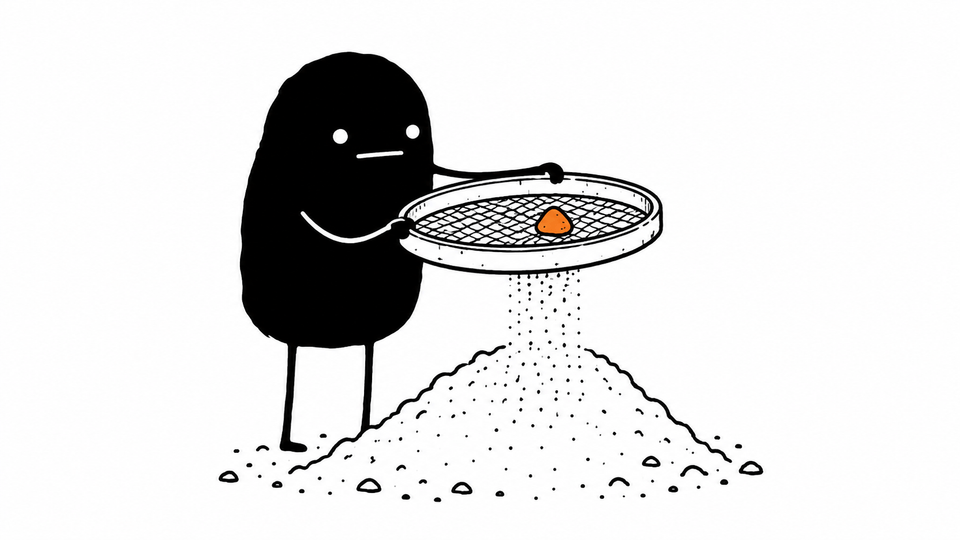 Lev sifts a heap of sand through a garden sieve, leaving one small orange pebble in the mesh.