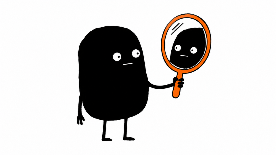 Lev holds up an orange hand mirror and studies his own reflection.