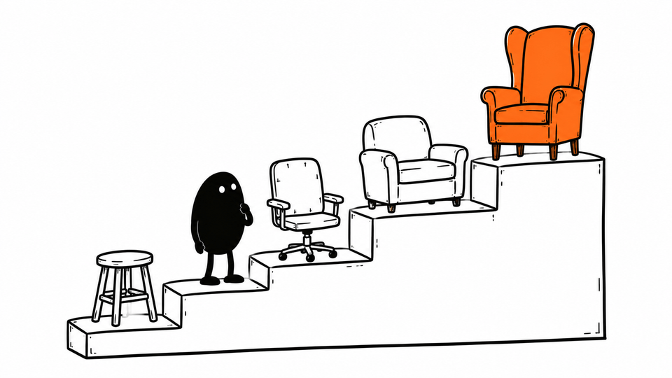 Lev stands on the second of four steps, each with a grander chair, the top one orange.