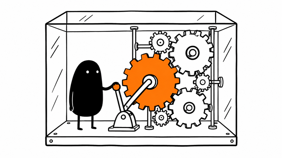 Lev stands inside a glass box of gears, one hand on a lever that turns the orange main gear.