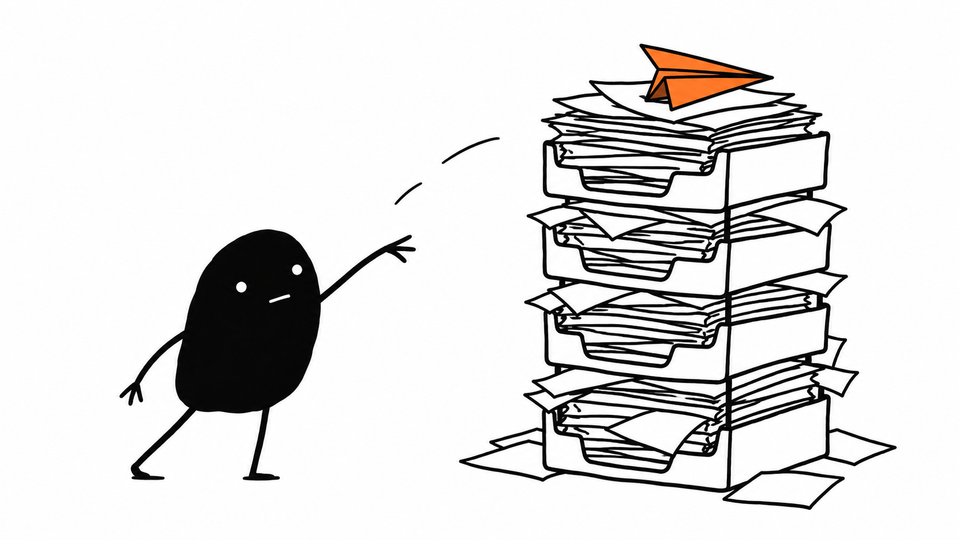 Lev has thrown an orange paper aeroplane that lands neatly on top of a tall stack of in-trays.